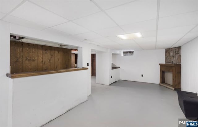 202 Linden Ave, Verona, NJ 07044 - finished below grade area with a drop ceiling, a fireplace, and wood walls