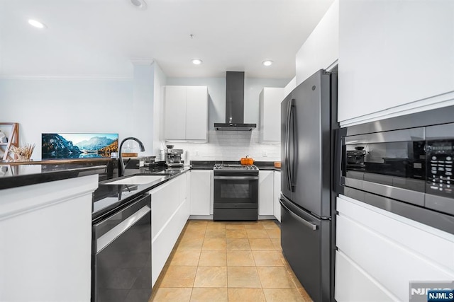 41 Lydia Dr Unit 41, West New York, NJ 07093 - kitchen with wall chimney exhaust hood, stainless steel appliances, a sink, dark countertops, and white cabinetry