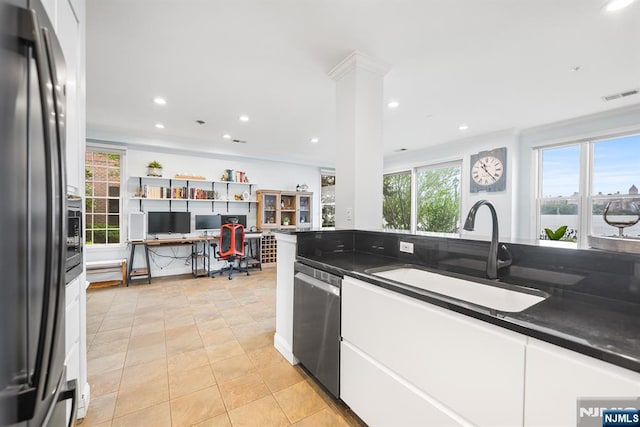 41 Lydia Dr Unit 41, West New York, NJ 07093 - kitchen with appliances with stainless steel finishes, a sink, dark countertops, white cabinets, and recessed lighting