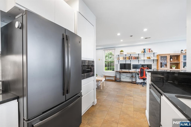 41 Lydia Dr Unit 41, West New York, NJ 07093 - kitchen featuring appliances with stainless steel finishes, dark countertops, white cabinetry, a desk, and recessed lighting