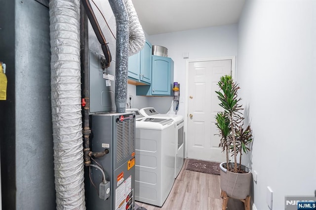 41 Lydia Dr Unit 41, West New York, NJ 07093 - laundry area with separate washer and dryer, cabinet space, light wood finished floors, and electric panel