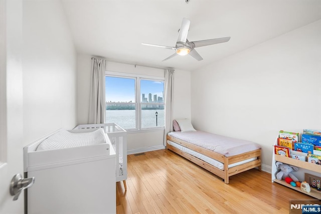 41 Lydia Dr Unit 41, West New York, NJ 07093 - bedroom featuring light wood-type flooring, baseboards, a ceiling fan, and a water view