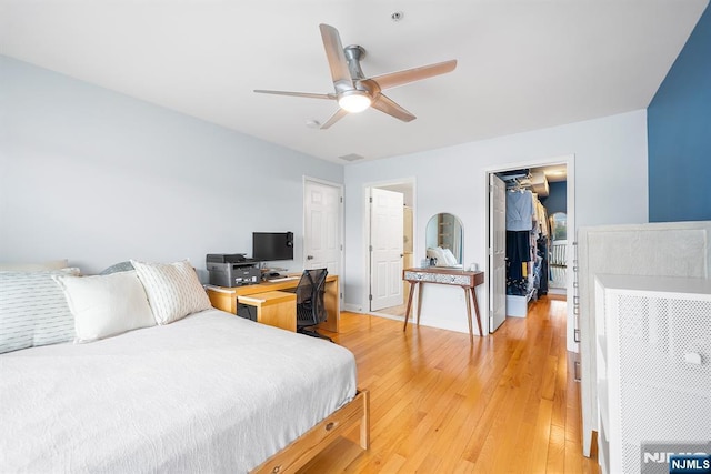 41 Lydia Dr Unit 41, West New York, NJ 07093 - bedroom featuring a spacious closet, light wood-style flooring, a closet, ceiling fan, and a desk