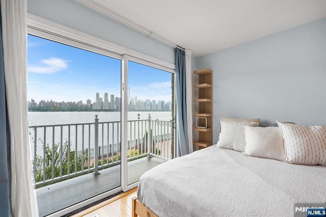 41 Lydia Dr Unit 41, West New York, NJ 07093 - bedroom with access to outside, wood finished floors, a water view, and a skyline view