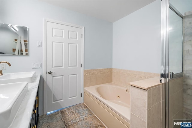 41 Lydia Dr Unit 41, West New York, NJ 07093 - full bathroom featuring double vanity, a tub with jets, and a stall shower
