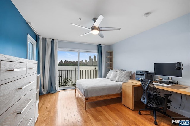 41 Lydia Dr Unit 41, West New York, NJ 07093 - bedroom with access to exterior, light wood-style flooring, an office area, and a ceiling fan