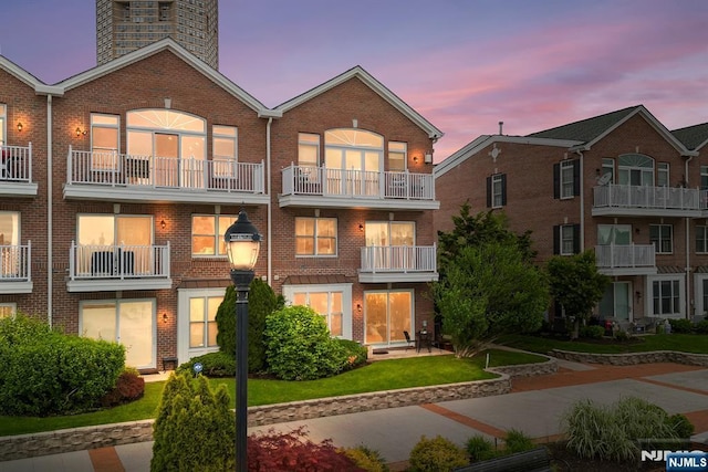 41 Lydia Dr Unit 41, West New York, NJ 07093 - back of property featuring brick siding and a balcony