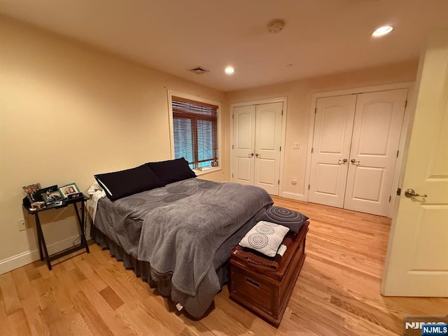 124 68th St Unit 204, Guttenberg, NJ 07093 - bedroom with two closets, light wood finished floors, recessed lighting, and baseboards
