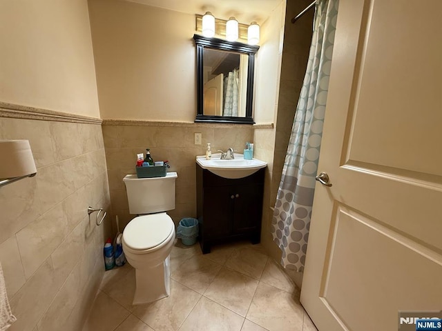 124 68th St Unit 204, Guttenberg, NJ 07093 - full bathroom featuring tile walls, toilet, vanity, tile patterned floors, and a shower with shower curtain