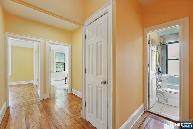 50 Reservoir Ave Unit 201, Jersey City, NJ 07307 - hallway featuring light wood-type flooring and baseboards