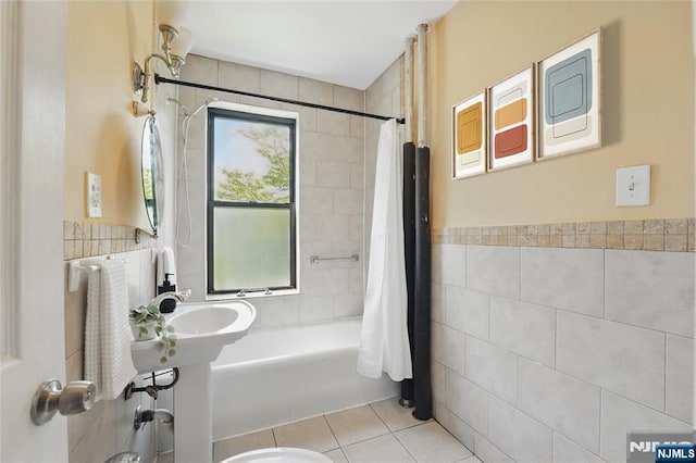 50 Reservoir Ave Unit 201, Jersey City, NJ 07307 - full bath with tile walls, tile patterned flooring, shower / tub combo, and a wainscoted wall