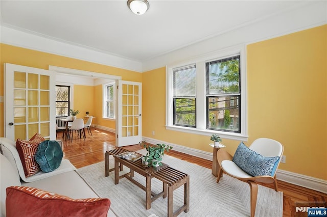 50 Reservoir Ave Unit 201, Jersey City, NJ 07307 - living area with french doors, healthy amount of natural light, baseboards, and ornamental molding