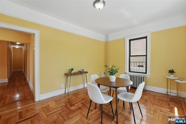 50 Reservoir Ave Unit 201, Jersey City, NJ 07307 - dining area with radiator, baseboards, and ornamental molding