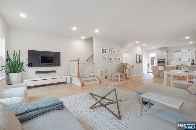 83 Landmark Ln, Fair Lawn, NJ 07410 - living area featuring stairway, light wood-style flooring, and recessed lighting