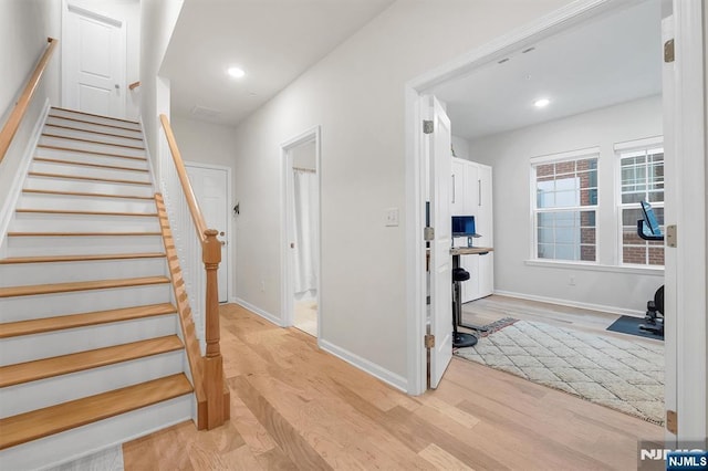 83 Landmark Ln, Fair Lawn, NJ 07410 - entryway featuring light wood finished floors, stairs, baseboards, and recessed lighting