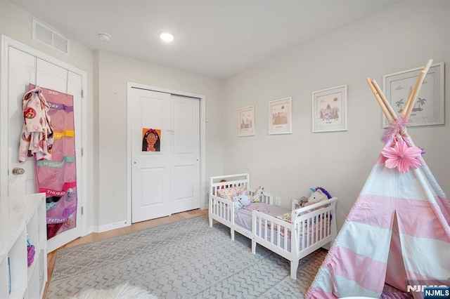 83 Landmark Ln, Fair Lawn, NJ 07410 - bedroom with wood finished floors, a closet, baseboards, and recessed lighting