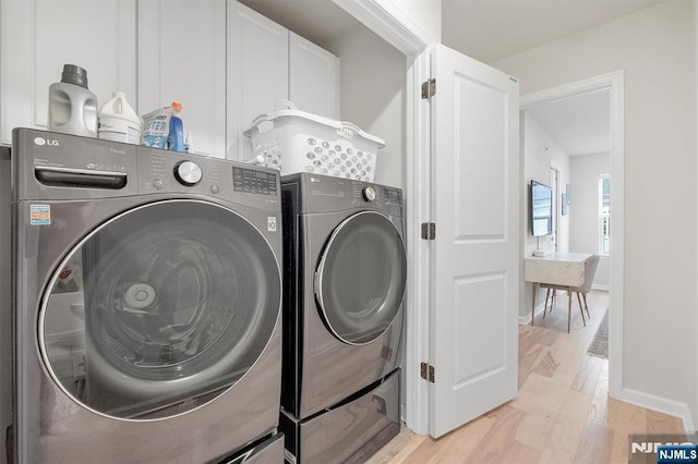 83 Landmark Ln, Fair Lawn, NJ 07410 - laundry area featuring independent washer and dryer, light wood-style flooring, and baseboards