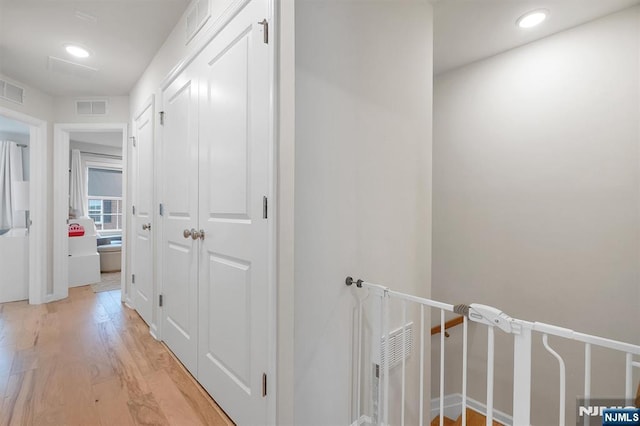 83 Landmark Ln, Fair Lawn, NJ 07410 - hall featuring light wood-type flooring, recessed lighting, and baseboards