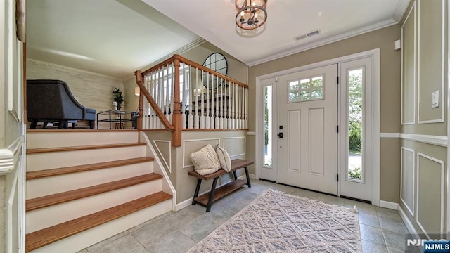 27 Bristol Pl, Wayne, NJ 07470 - foyer with stairway, a chandelier, baseboards, and crown molding