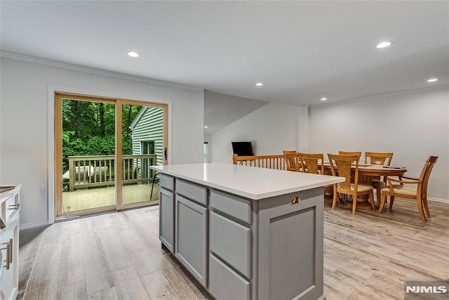 53 Princeton Pl, Wayne, NJ 07470 - kitchen featuring gray cabinets, ornamental molding, light wood-type flooring, a kitchen island, and recessed lighting