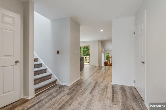 53 Princeton Pl, Wayne, NJ 07470 - hallway with wood finished floors, recessed lighting, stairway, and baseboards