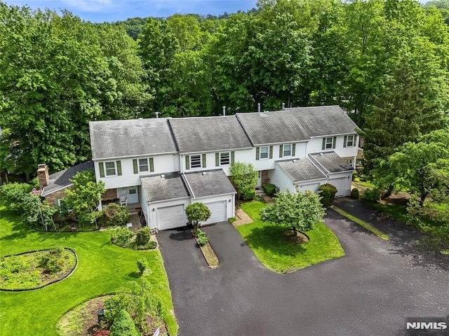 53 Princeton Pl, Wayne, NJ 07470 - townhome / multi-family property with driveway, an attached garage, and a front lawn