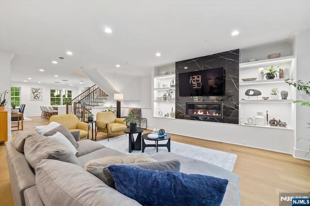 110 Mason Ct Unit 2H, Haworth, NJ 07641 - living area featuring stairs, wood finished floors, recessed lighting, and a premium fireplace