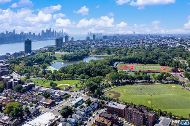 9060 Palisade Unit 612, North Bergen, NJ 07047 - aerial view of property's location with skyline, a nearby body of water, and a tree filled landscape