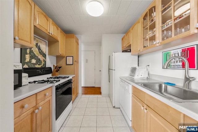 9060 Palisade Unit 612, North Bergen, NJ 07047 - kitchen with white appliances, a sink, light countertops, glass insert cabinets, and light brown cabinetry
