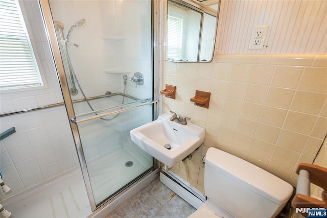 57 Burnside, Wanaque, NJ 07420 - bathroom with a baseboard radiator, toilet, healthy amount of natural light, tile walls, and a sink