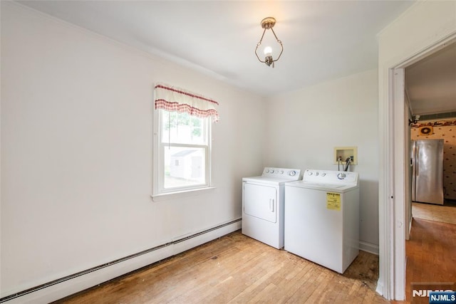 57 Burnside, Wanaque, NJ 07420 - laundry room with washer and dryer, a baseboard heating unit, light wood finished floors, and ornamental molding