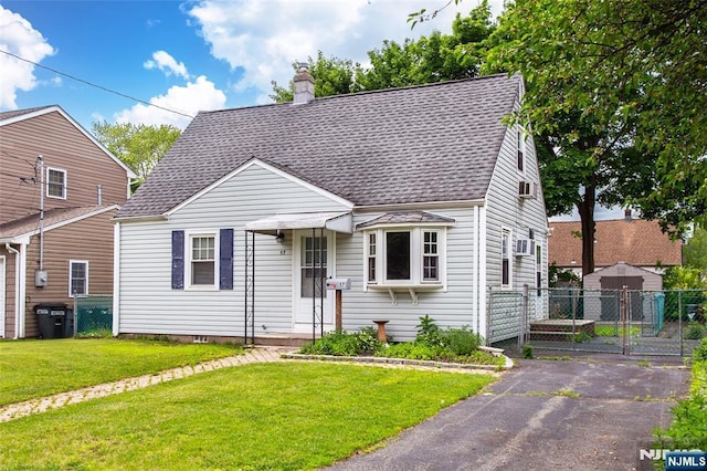 57 Burnside, Wanaque, NJ 07420 - view of front of home with roof with shingles and a chimney