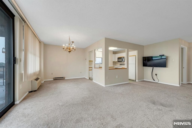 200 Division Unit 6H, Cliffside Park, NJ 07010 - unfurnished living room with a chandelier, light carpet, a baseboard heating unit, baseboards, and a textured ceiling