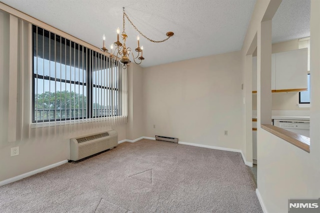 200 Division Unit 6H, Cliffside Park, NJ 07010 - carpeted empty room with a chandelier, healthy amount of natural light, baseboard heating, a textured ceiling, and baseboards