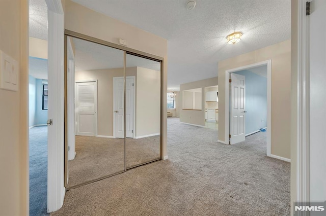 200 Division Unit 6H, Cliffside Park, NJ 07010 - hallway with carpet, a textured ceiling, and baseboards