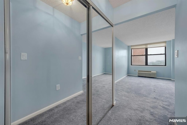 200 Division Unit 6H, Cliffside Park, NJ 07010 - unfurnished bedroom with carpet flooring, a textured ceiling, a closet, and baseboards