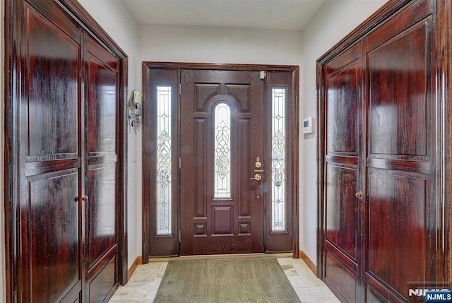 238 E Johnson Ave, Bergenfield, NJ 07621 - foyer featuring baseboards and plenty of natural light
