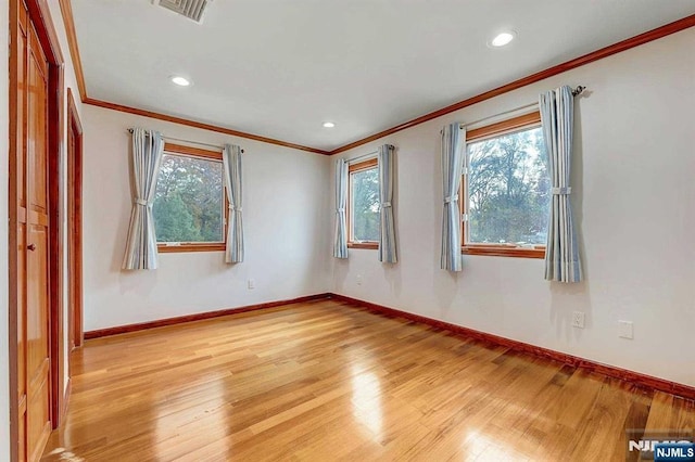 238 E Johnson Ave, Bergenfield, NJ 07621 - spare room with ornamental molding, light wood-style floors, baseboards, and recessed lighting