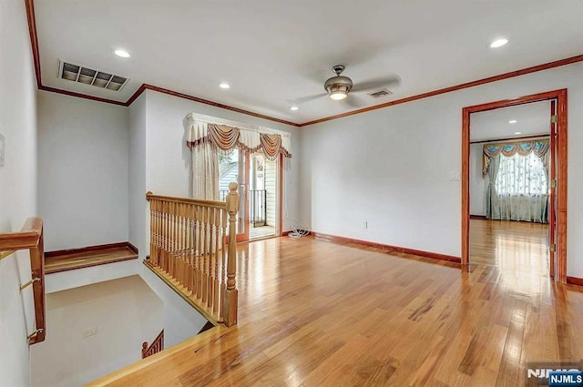 238 E Johnson Ave, Bergenfield, NJ 07621 - empty room featuring crown molding, plenty of natural light, wood finished floors, ceiling fan, and recessed lighting