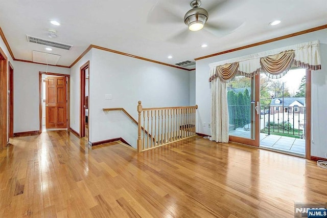 238 E Johnson Ave, Bergenfield, NJ 07621 - spare room featuring ornamental molding, light wood-style flooring, baseboards, attic access, and a ceiling fan