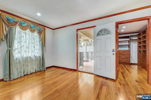 238 E Johnson Ave, Bergenfield, NJ 07621 - foyer with light wood finished floors, baseboards, ornamental molding, and recessed lighting