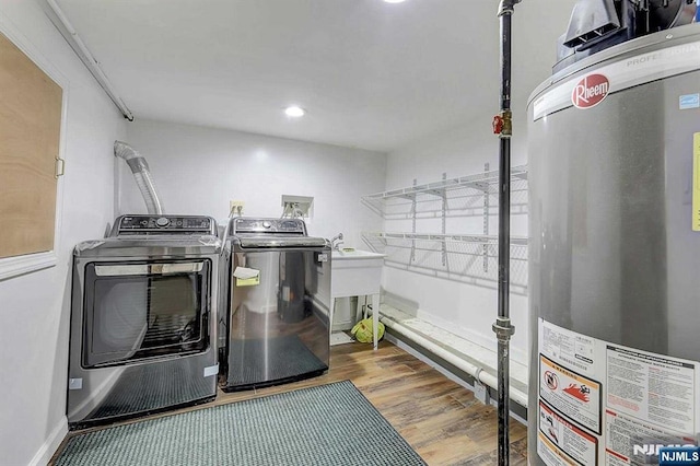 238 E Johnson Ave, Bergenfield, NJ 07621 - laundry room with water heater, washing machine and clothes dryer, wood finished floors, and recessed lighting