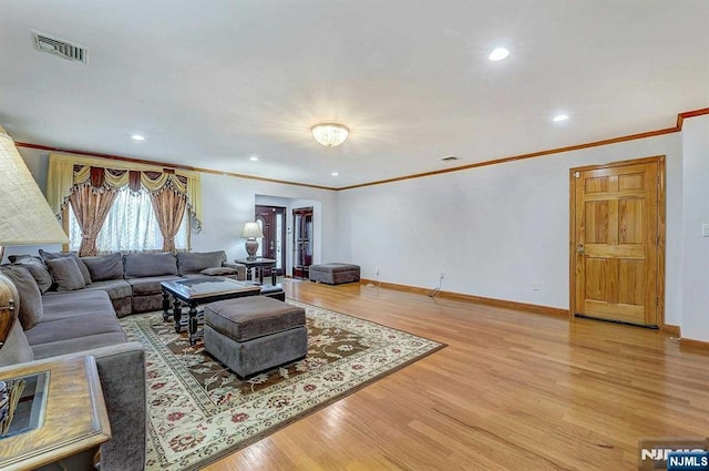 238 E Johnson Ave, Bergenfield, NJ 07621 - living area featuring crown molding, light wood-style flooring, baseboards, and recessed lighting