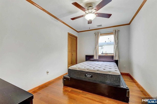 238 E Johnson Ave, Bergenfield, NJ 07621 - bedroom with wood finished floors, baseboards, crown molding, and a ceiling fan