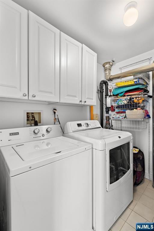443 Albany Ct Unit 443, West New York, NJ 07093 - laundry room with separate washer and dryer, cabinet space, and light tile patterned floors