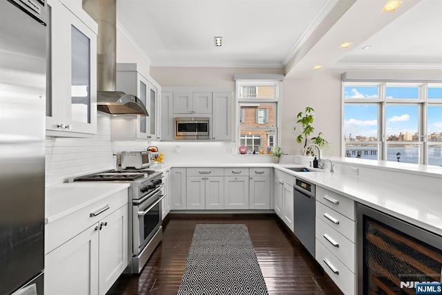 443 Albany Ct Unit 443, West New York, NJ 07093 - kitchen with built in appliances, a sink, beverage cooler, ornamental molding, and tasteful backsplash