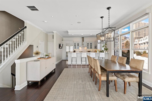 443 Albany Ct Unit 443, West New York, NJ 07093 - dining room with a chandelier, dark wood-style floors, stairway, ornamental molding, and baseboards