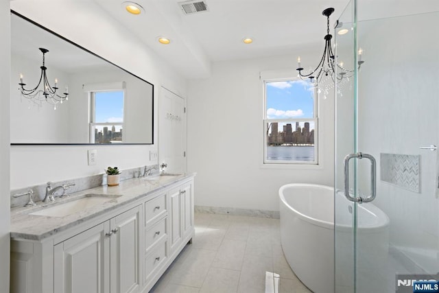 443 Albany Ct Unit 443, West New York, NJ 07093 - bathroom with a chandelier, plenty of natural light, a freestanding bath, and recessed lighting