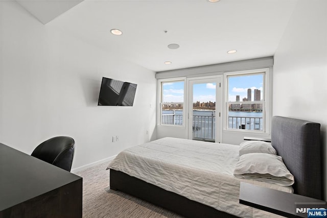 443 Albany Ct Unit 443, West New York, NJ 07093 - carpeted bedroom featuring access to outside, recessed lighting, an office area, and baseboards