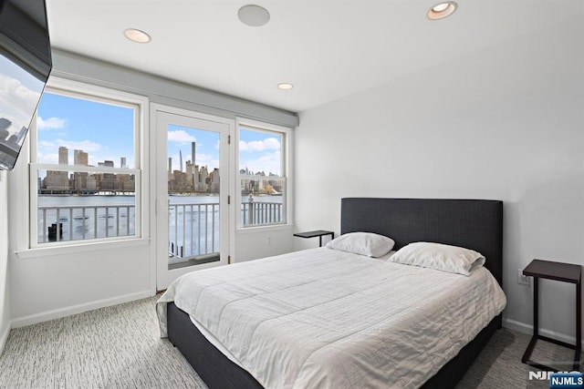 443 Albany Ct Unit 443, West New York, NJ 07093 - carpeted bedroom with access to outside, a water view, baseboards, and recessed lighting